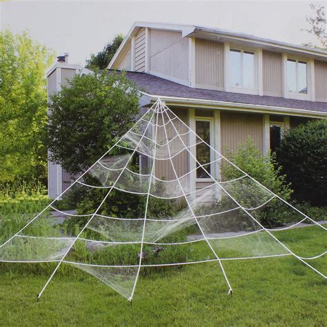 Large spider web decoration - Make your whole yard spooky with this giant spider web that starts at your roof and spreads across your yard. Full written tutorial with tips here: https://w...
